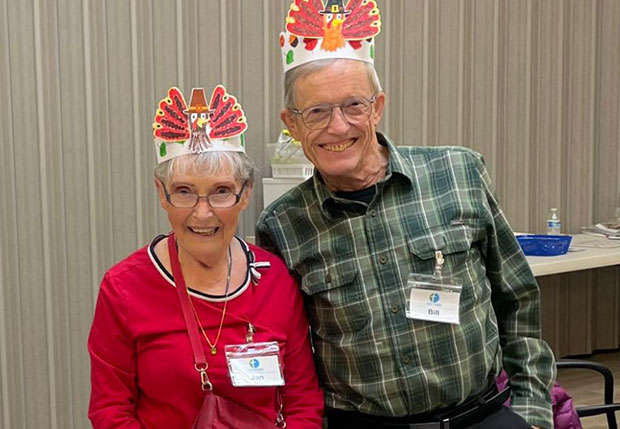Woman and man with Thanksgiving Day hats